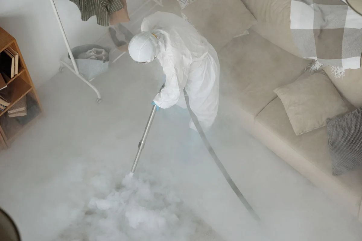 Biohazard cleanup technician in protective equipment, Kincora, VA